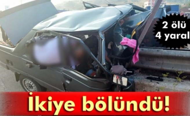 Bariyerlere çarpan otomobil ikiye bölündü