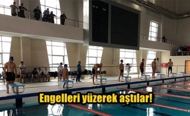 Engelleri yüzerek aştılar!