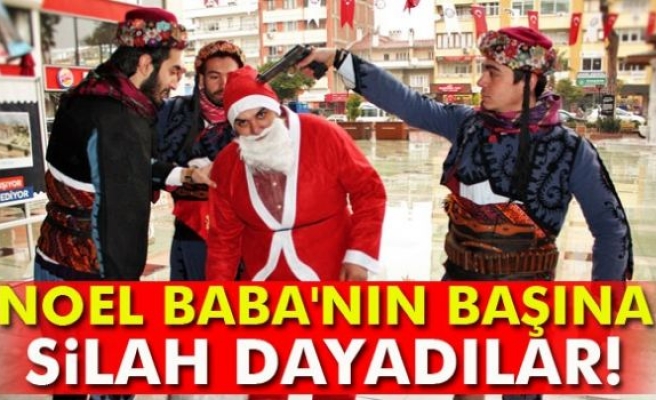 Noel Baba'nın başına silah dayadılar